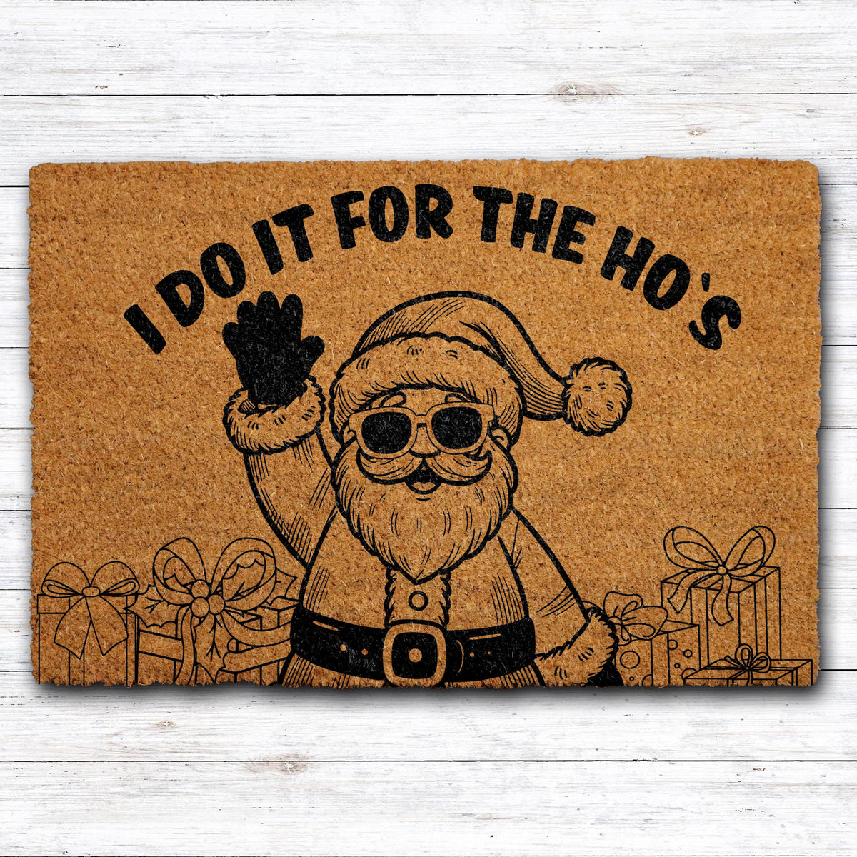 Doormat with Santa in sunglasses and "I do it for the ho’s" lettering
