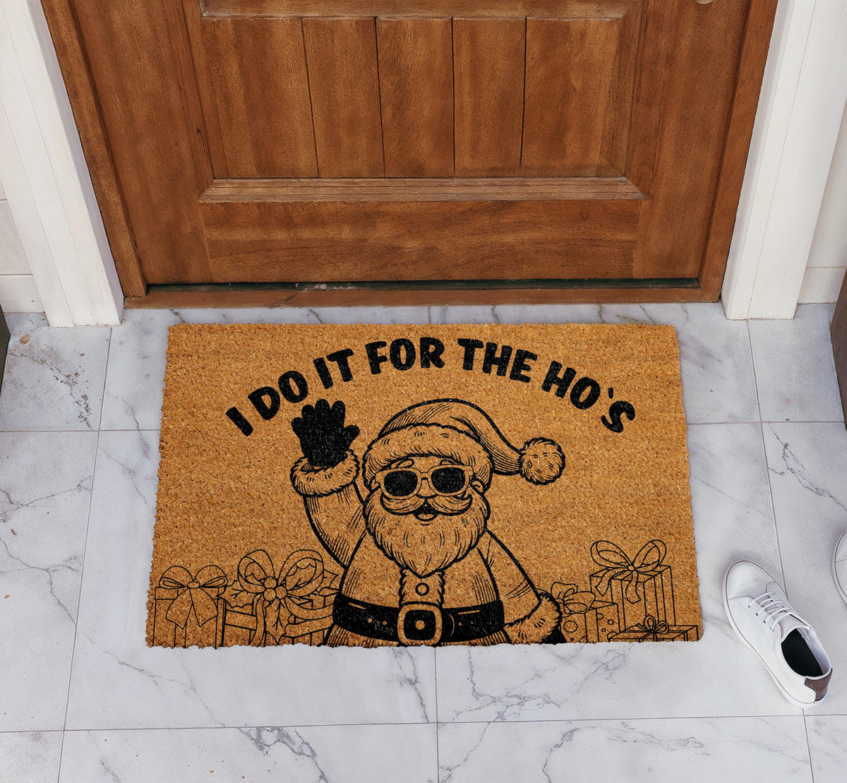 Doormat with Santa in sunglasses and "I do it for the ho’s" lettering