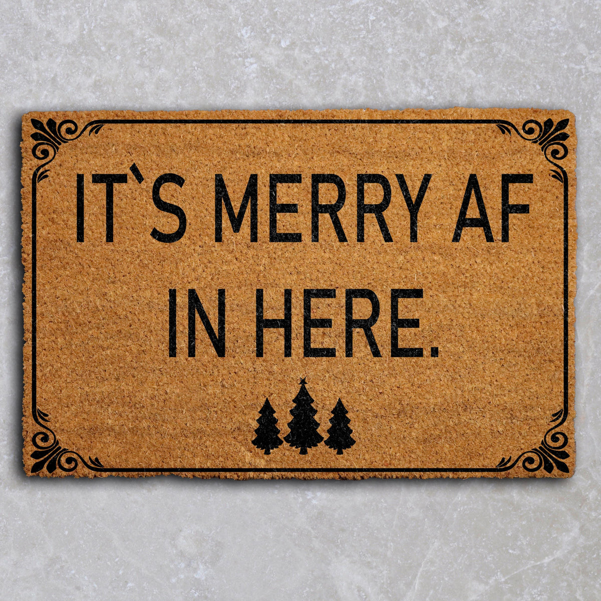 Doormat with "It’s merry AF in here" block lettering and three trees