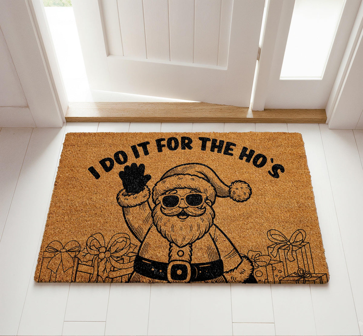 Doormat with Santa in sunglasses and "I do it for the ho’s" lettering