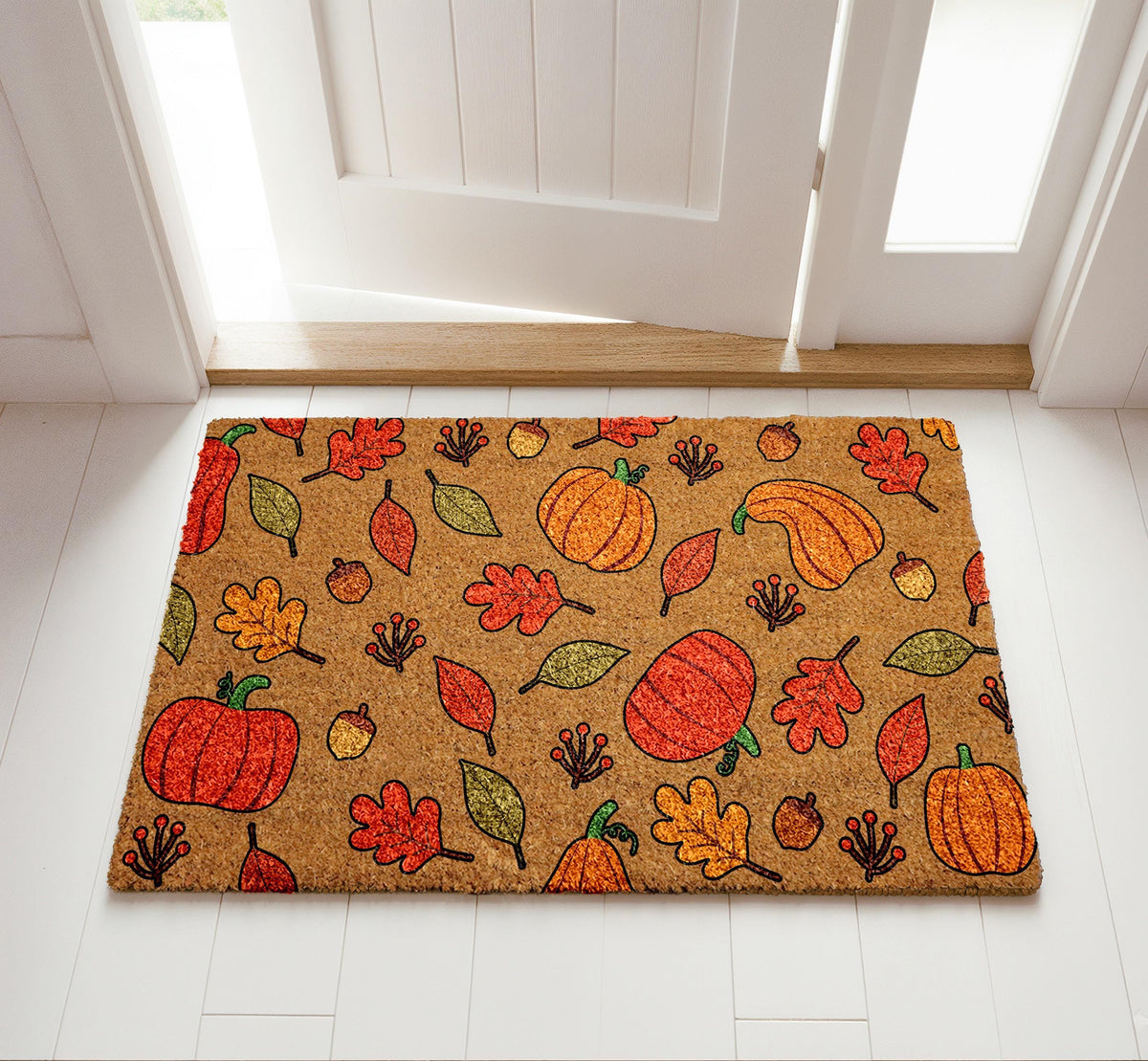 Doormat with autumn leaves, pumpkins and acorns