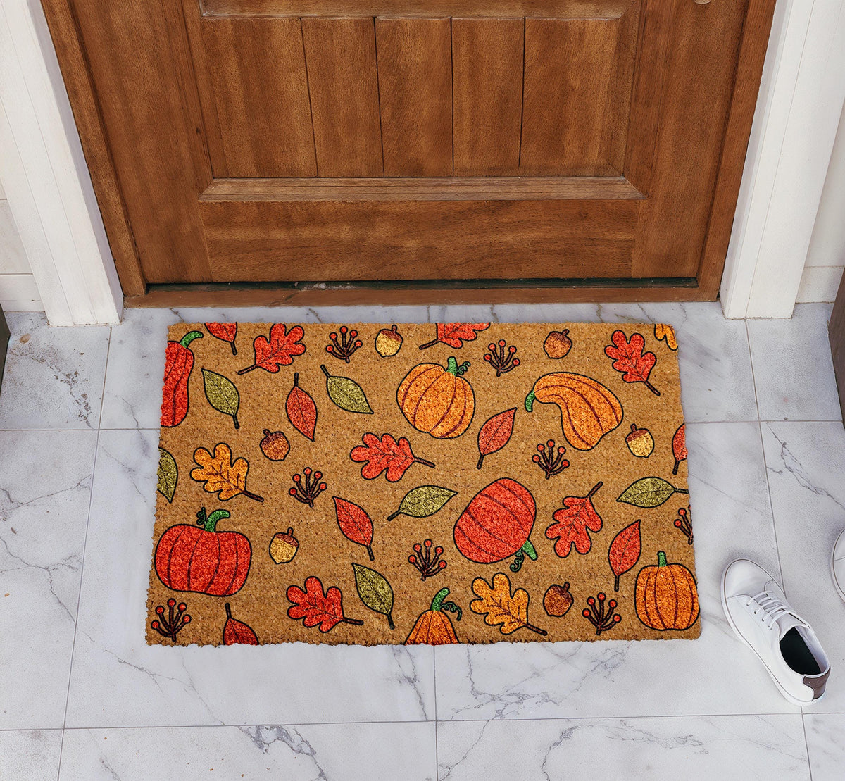 Doormat with autumn leaves, pumpkins and acorns