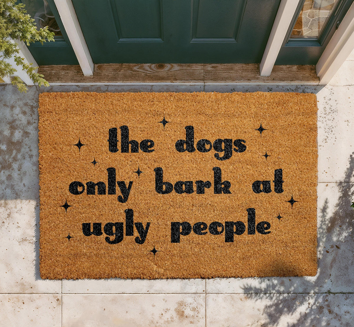 The Dogs Only Bark at Ugly People Coir Doormat
