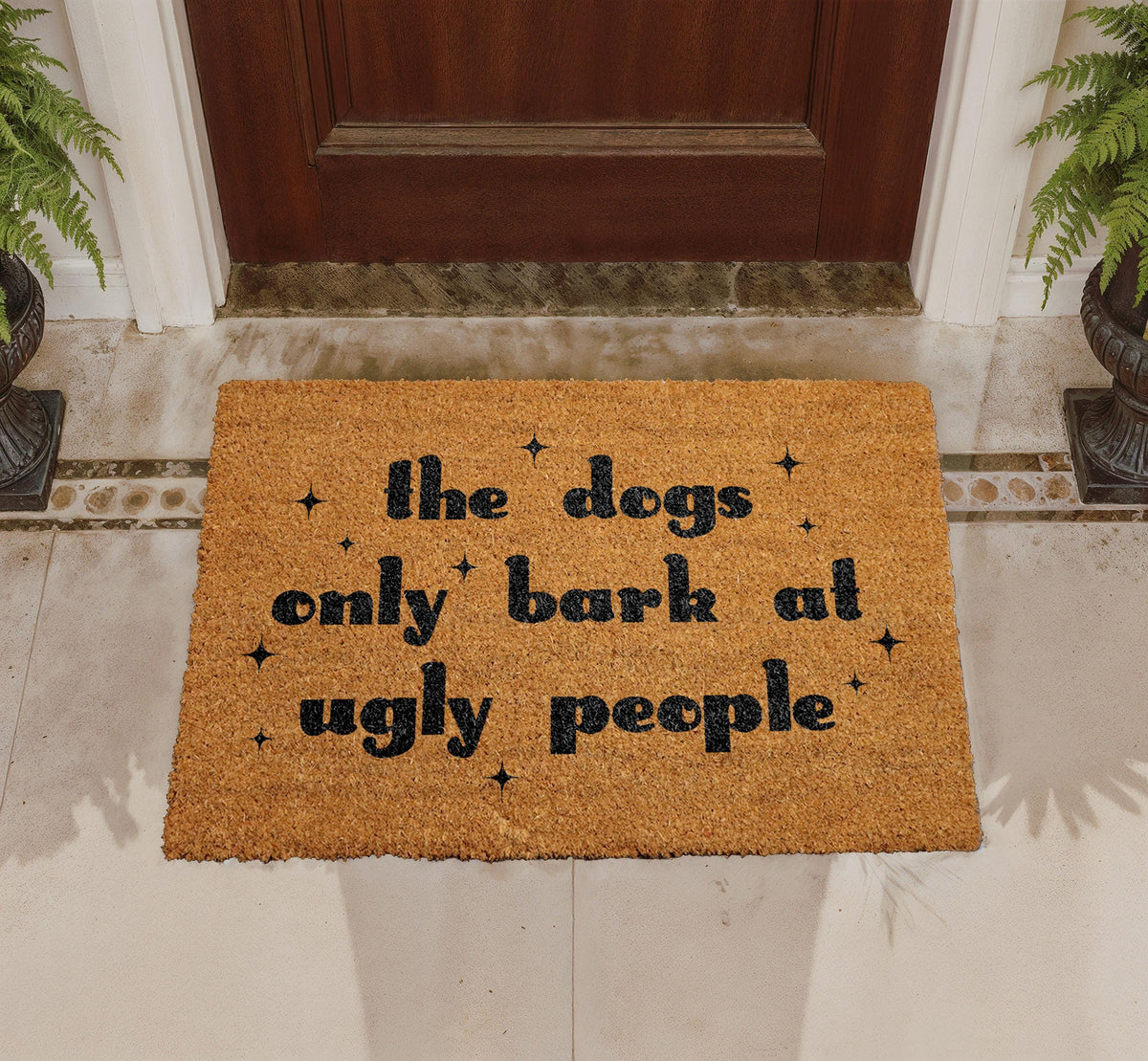 The Dogs Only Bark at Ugly People Coir Doormat
