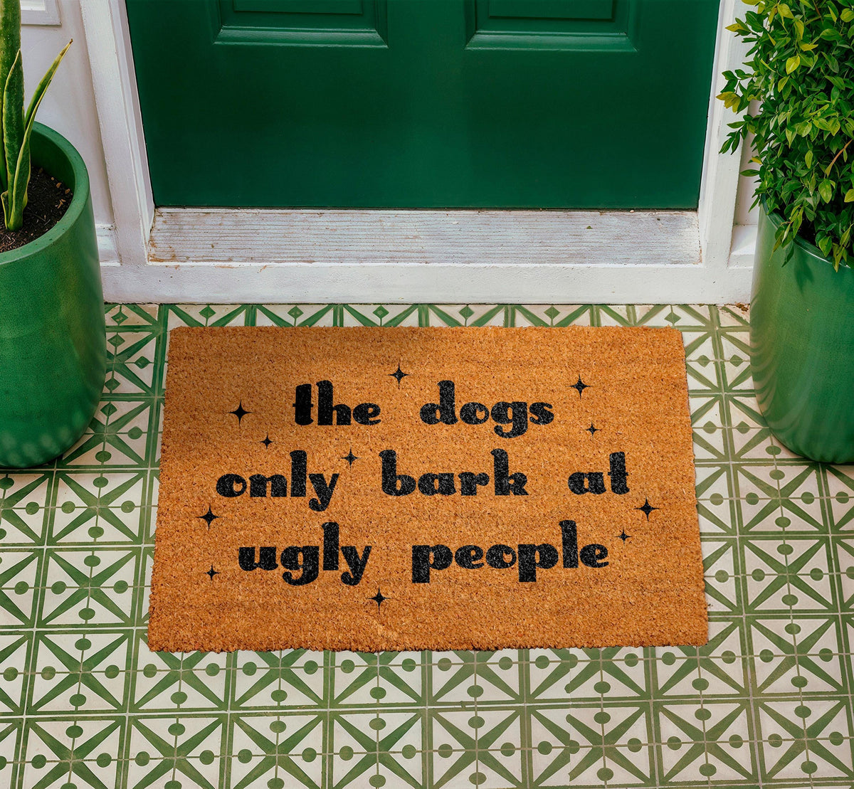 The Dogs Only Bark at Ugly People Coir Doormat