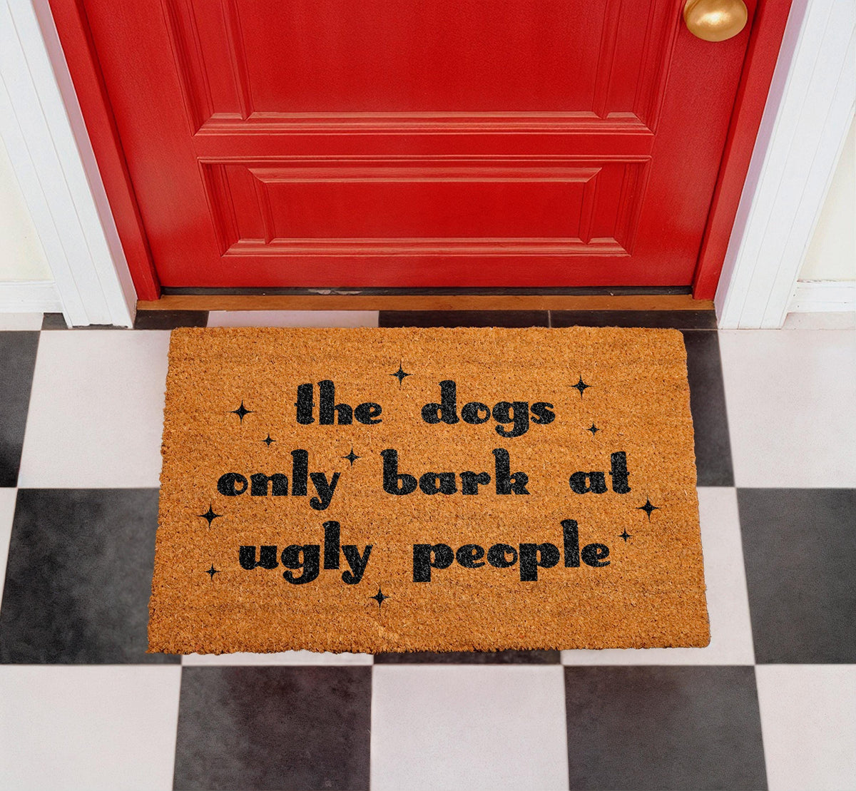 The Dogs Only Bark at Ugly People Coir Doormat