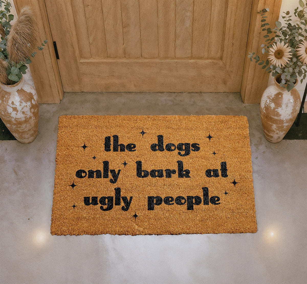 The Dogs Only Bark at Ugly People Coir Doormat