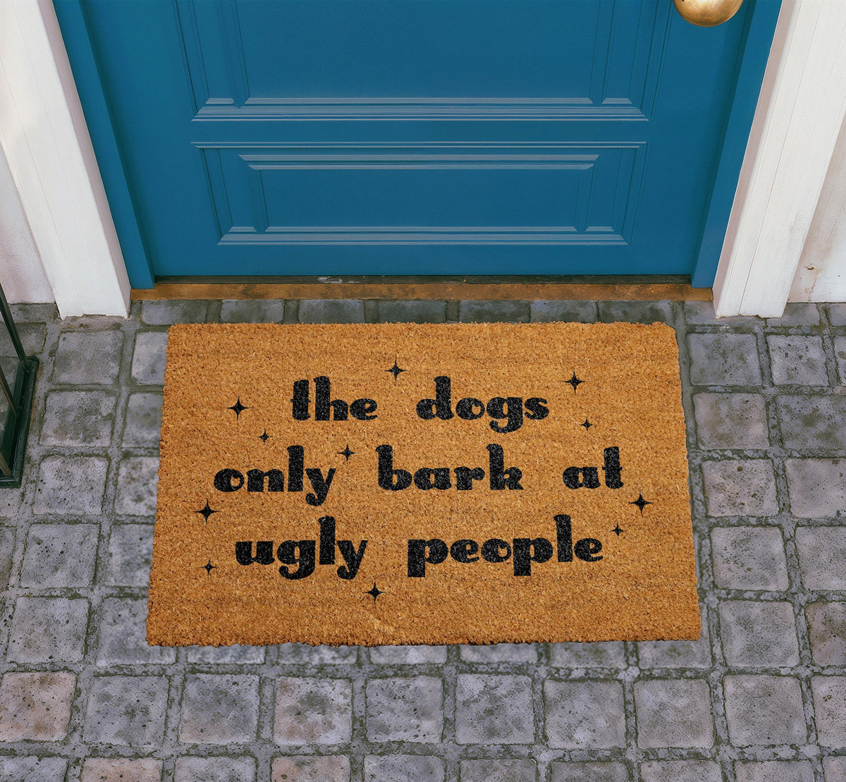 The Dogs Only Bark at Ugly People Coir Doormat