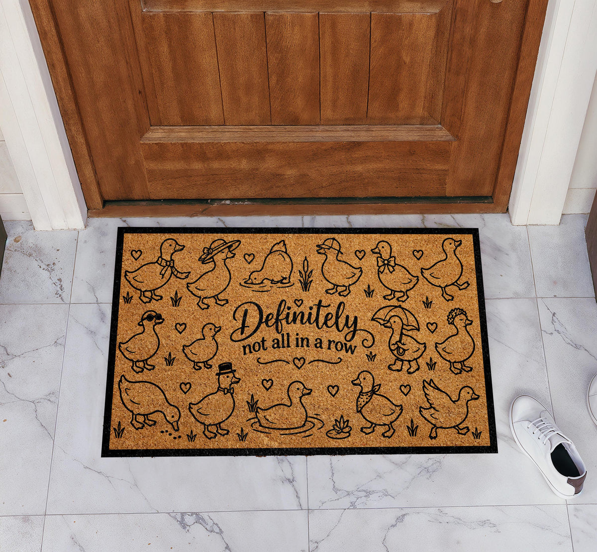 Doormat with dressed-up geese and "Definitely not all in a row" lettering