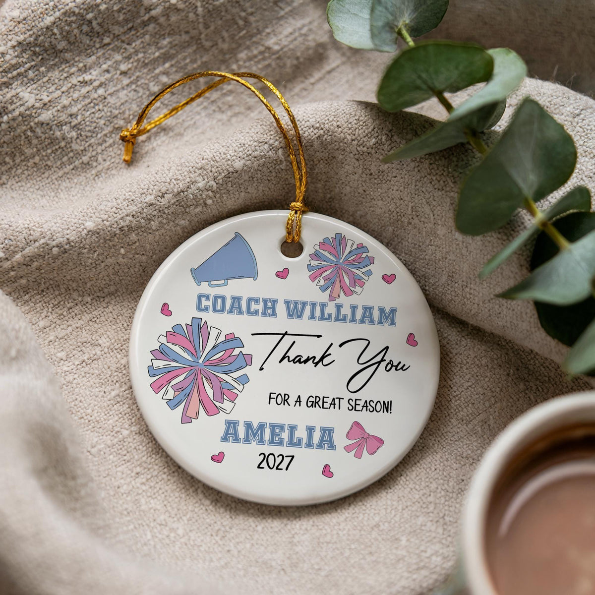 Round ornament with pompoms and personalized cheer coach lettering