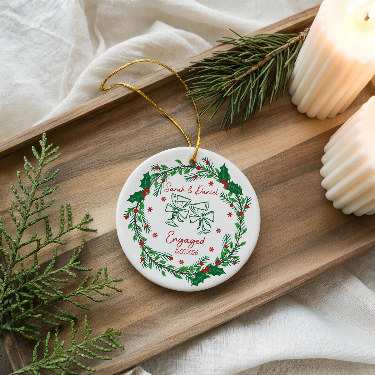 Round ornament with engagement-themed illustrations and personalized lettering
