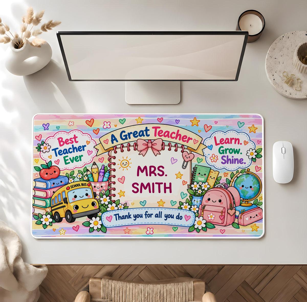 Desk mat with school supplies and a personalized teacher name