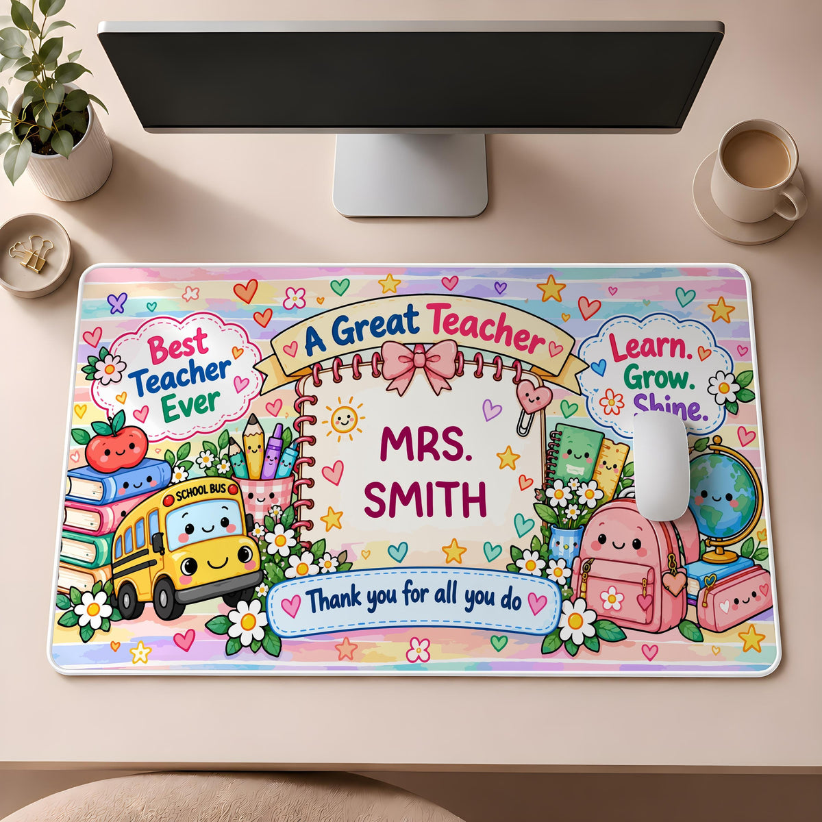Desk mat with school supplies and a personalized teacher name