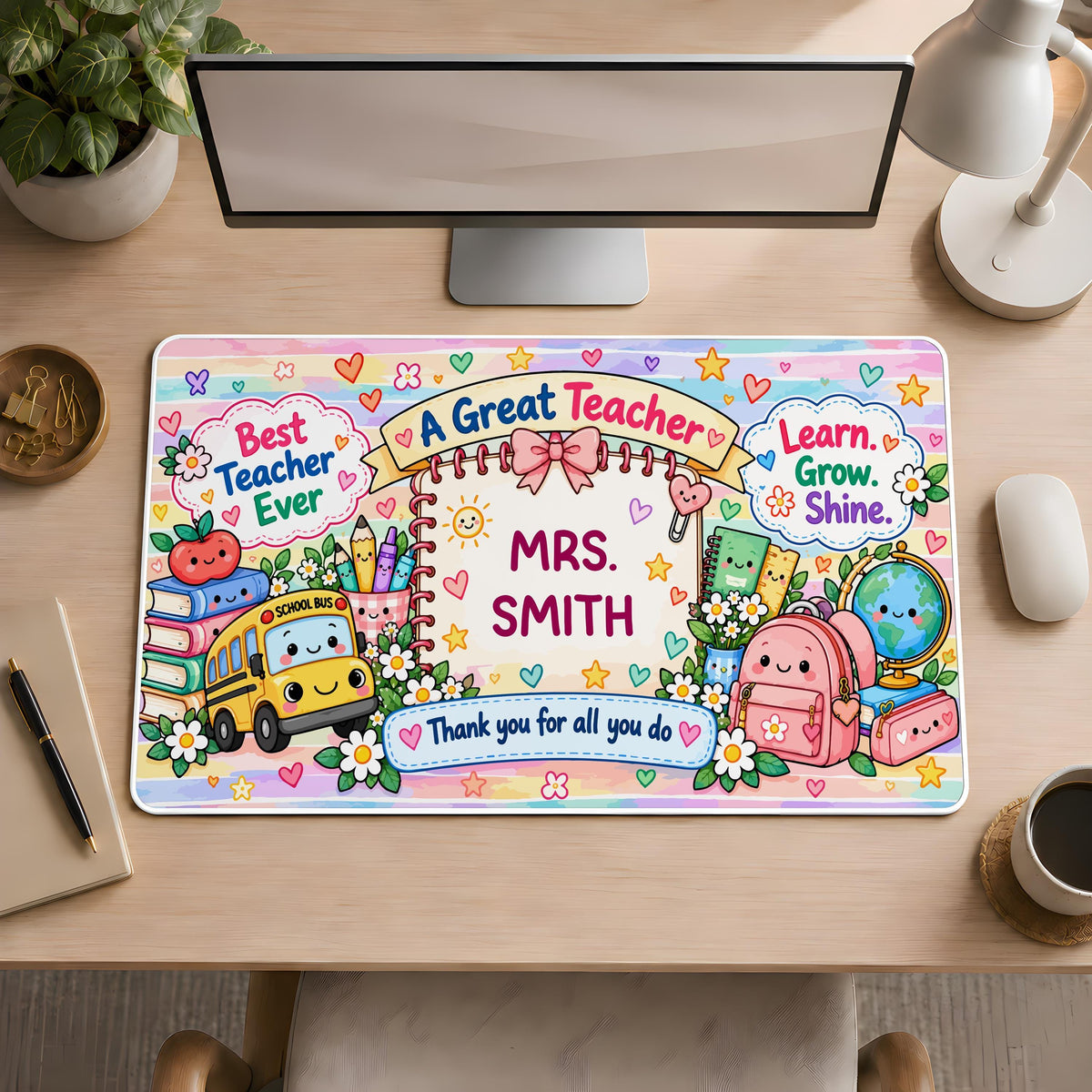 Desk mat with school supplies and a personalized teacher name