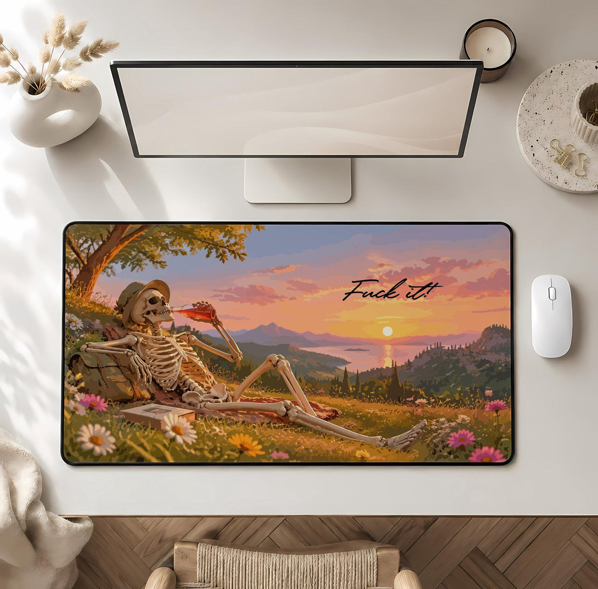 Desk mat with a reclining skeleton, landscape and "Fuck it" lettering