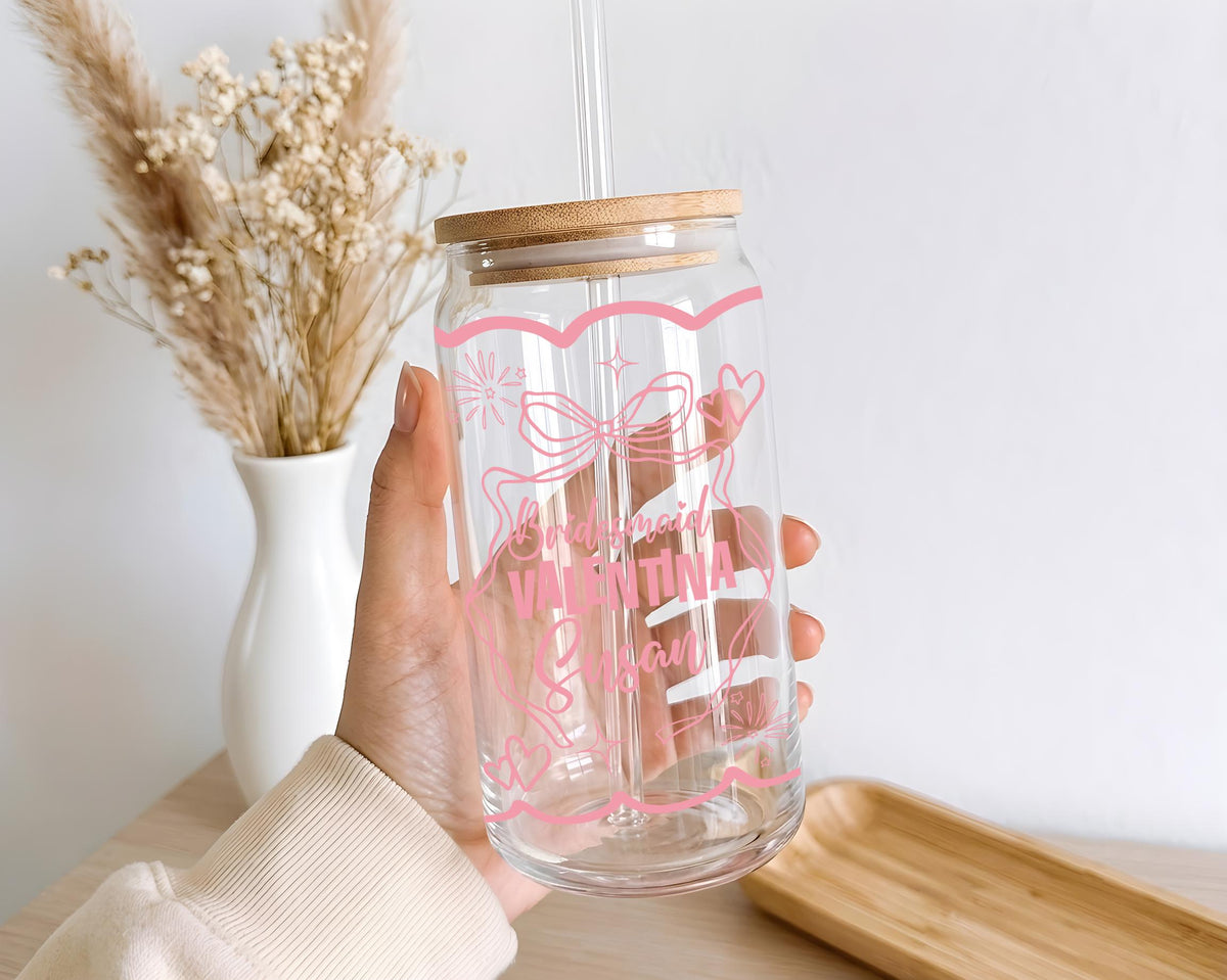 Glass with pink bridesmaid lettering, bows and wedding illustrations