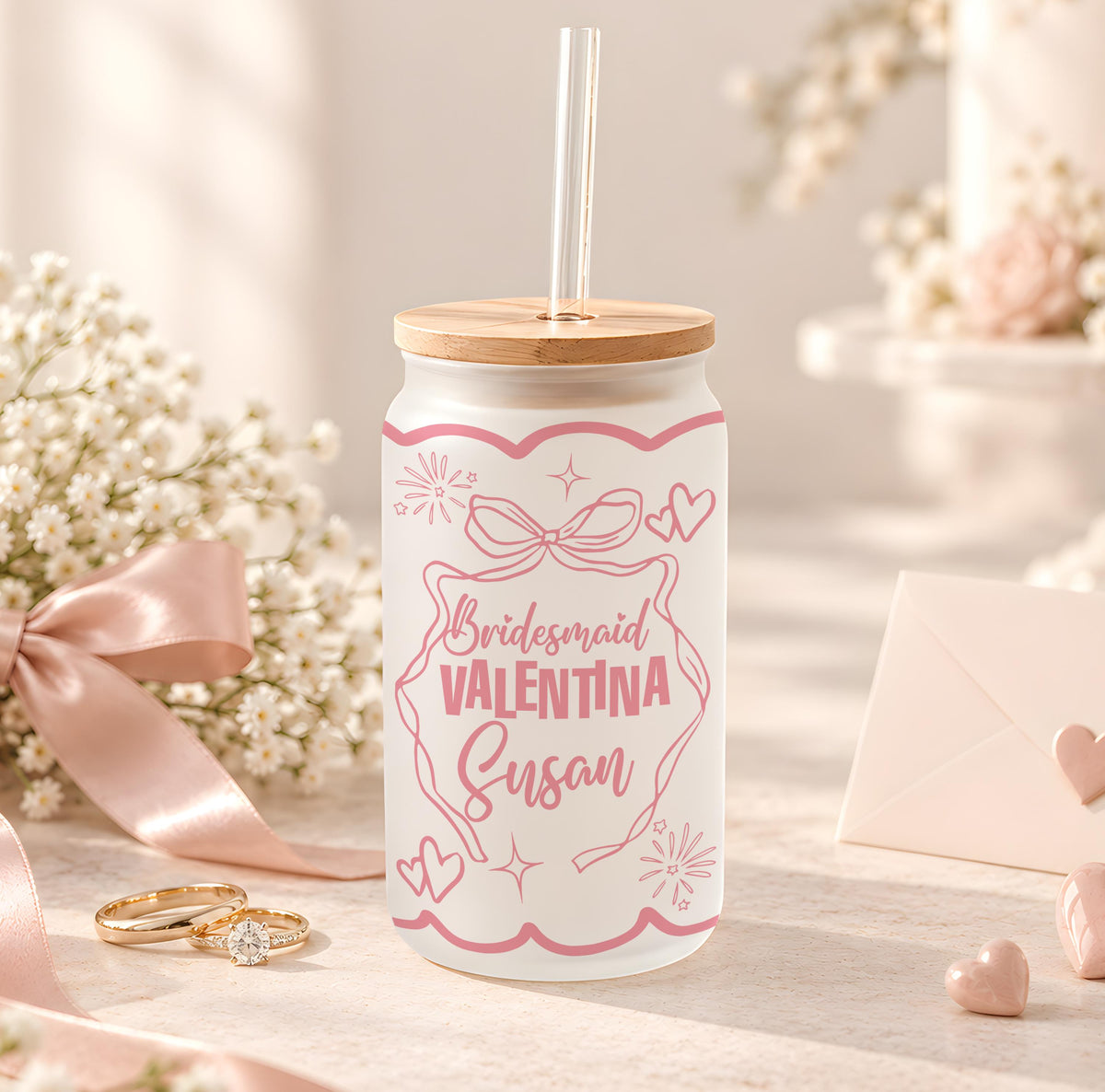 Glass with pink bridesmaid lettering, bows and wedding illustrations