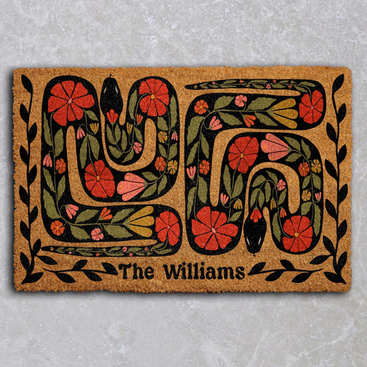 Doormat with two snakes, flowers and a personalized family name
