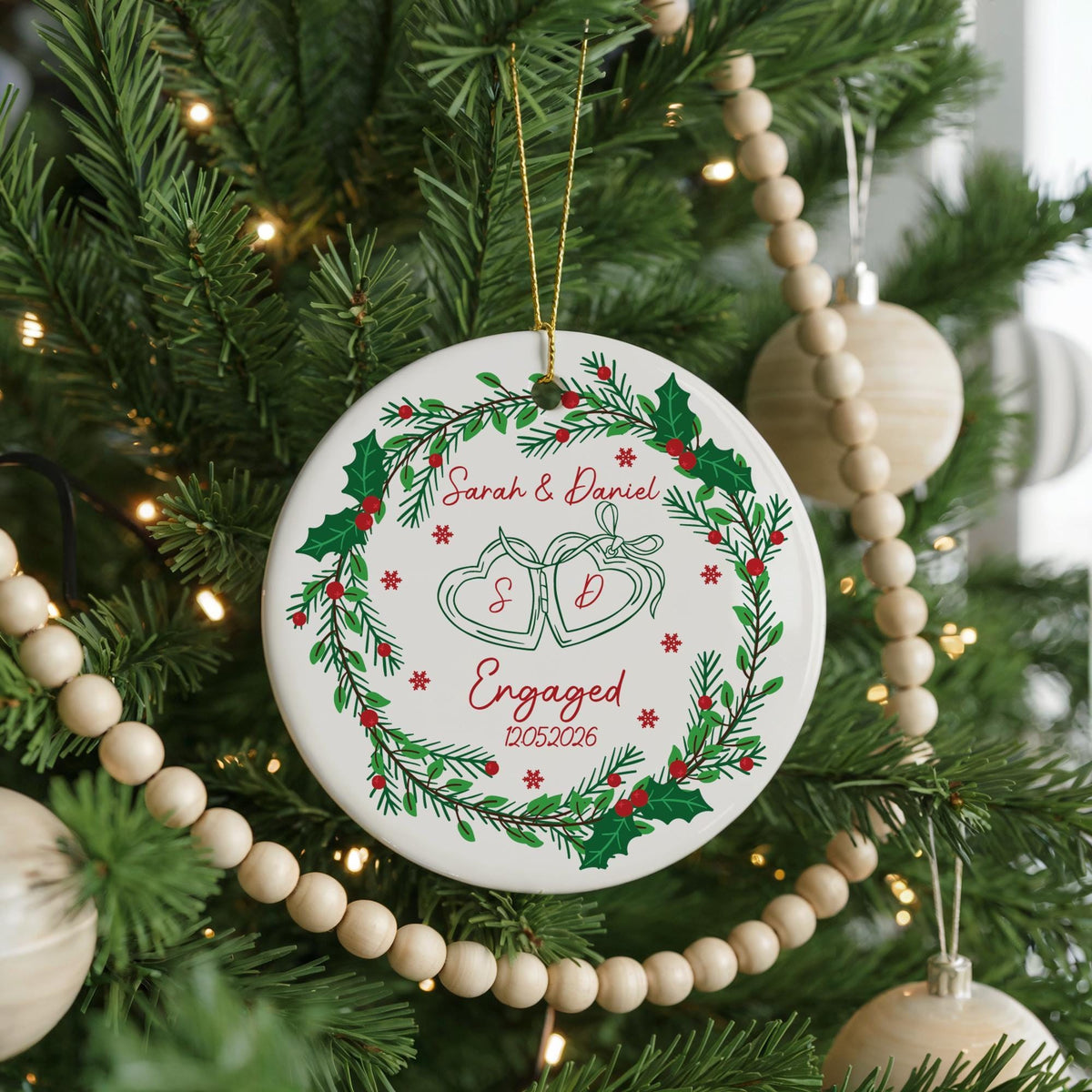 Round ornament with engagement-themed illustrations and personalized lettering