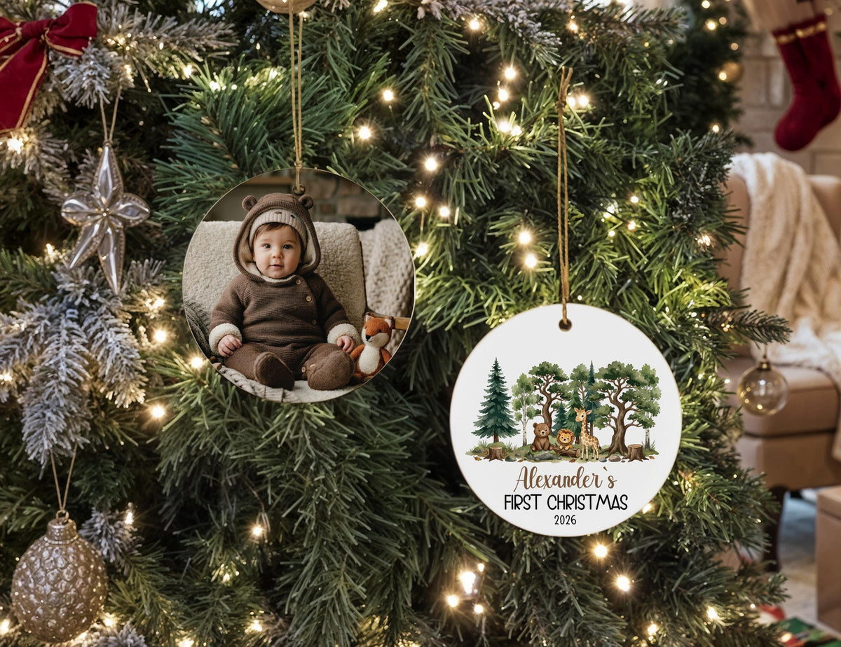 Two ornament views showing a baby photo and a personalized woodland first Christmas design