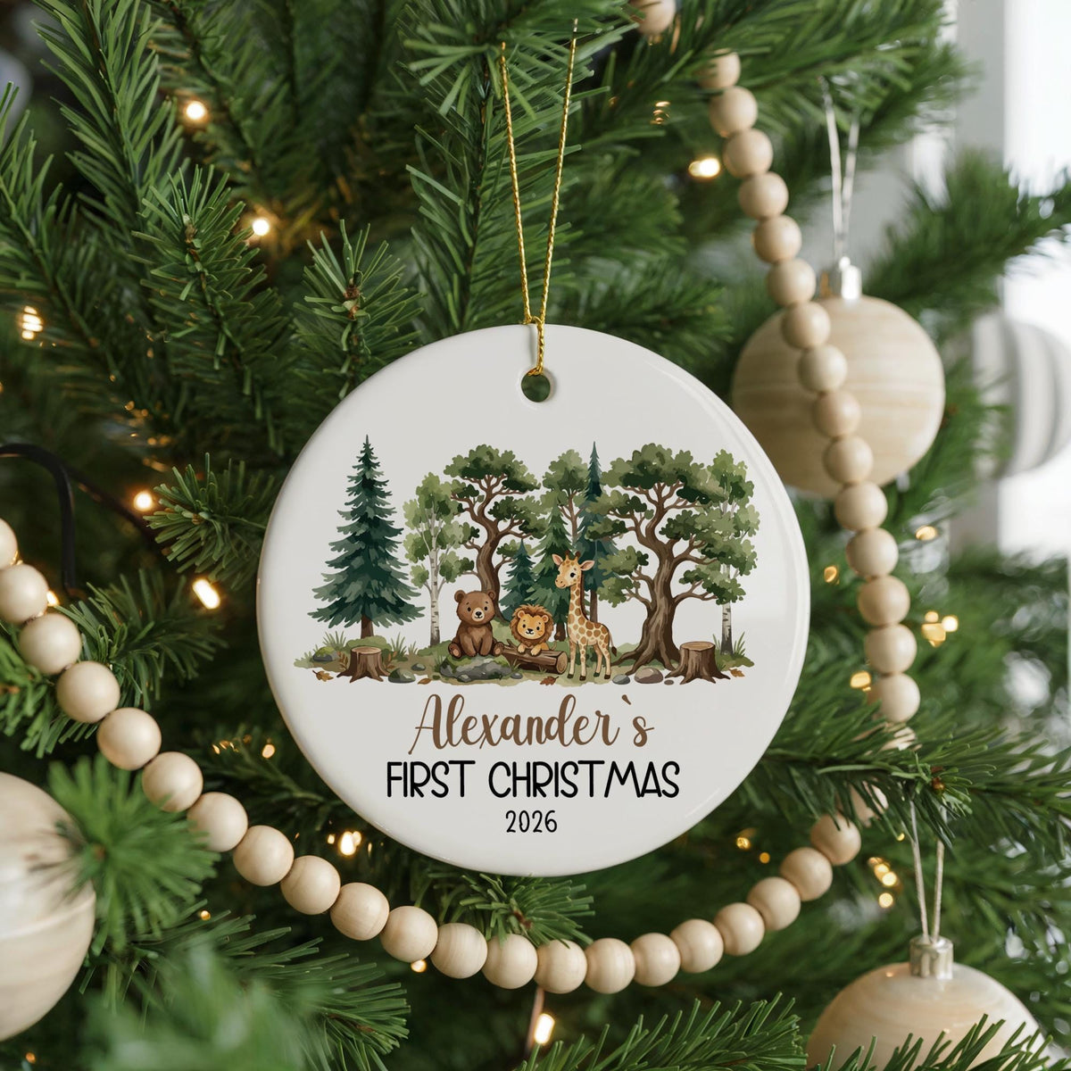 Round ornament with woodland animals and personalized first Christmas lettering