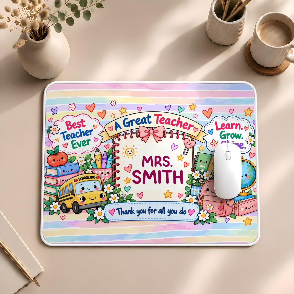 Desk mat with school supplies and a personalized teacher name