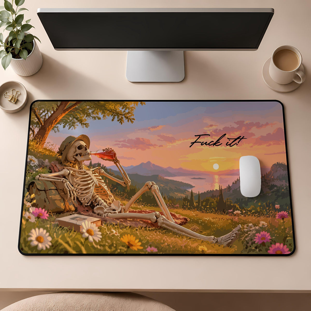 Desk mat with a reclining skeleton, landscape and "Fuck it" lettering