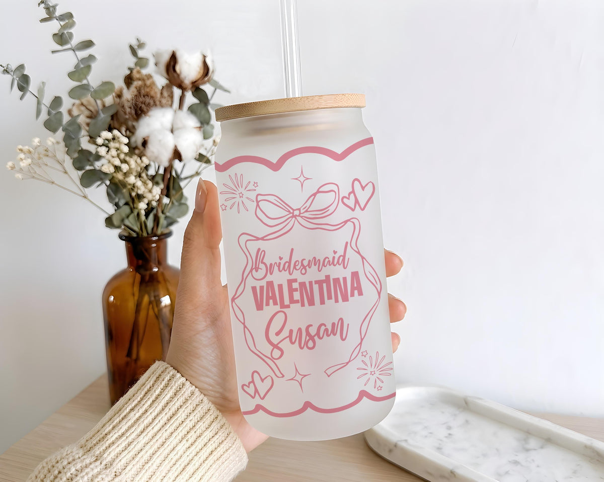Glass with pink bridesmaid lettering, bows and wedding illustrations